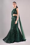 Samyukta Singhania_Emerald Green Net, Lycra Sequins, Embroidery Round Neck Wavy Hand Lehenga Set _at_Aza_Fashions