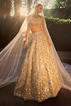Buy Tamanna Punjabi Kapoor Gold Tissue Sequins, Mirrors, Zari, Beads, Embellished Lehenga Blouse Set at Aza Fashions Buy_Tamanna Punjabi Kapoor_Gold Tissue Sequins, Mirrors, Zari, Beads, Embellished Lehenga Blouse Set _at_Aza_Fashions