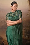 BAANI KHURANA_Emerald Green Satin Sequins, Beads, Embroidery Round Neck Draped Skirt Set _Online_at_Aza_Fashions