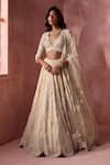 Nitika Gujral_Cream Organza, Net, Satin Embroidery, Sequins, Beads, Floral Pattern Lehenga Set _at_Aza_Fashions