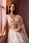 Buy_Nitika Gujral_White Net, Satin Applique, Beads, Sequins, Crystals V-neck Leather Lehenga Set _Online_at_Aza_Fashions