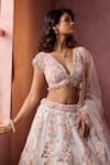 Shop_Nitika Gujral_White Net, Satin Applique, Beads, Sequins, Crystals V-neck Leather Lehenga Set _Online_at_Aza_Fashions
