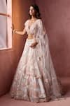 Nitika Gujral_White Net, Satin Applique, Beads, Sequins, Crystals V-neck Leather Lehenga Set _at_Aza_Fashions