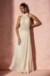Buy Nitika Gujral Ivory Chiffon, Satin, Organza Pearls, Fringe Halter Pleated Skirt And Blouse Set at Aza Fashions Buy_Nitika Gujral_Ivory Chiffon, Satin, Organza Pearls, Fringe Halter Pleated Skirt And Blouse Set _at_Aza_Fashions