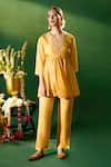 Samyukta Singhania Mustard Silk Embroidery, Mirrors V-neck Hand Tunic And Pant Set at Aza Fashions Samyukta Singhania_Mustard Silk Embroidery, Mirrors V-neck Hand Tunic And Pant Set _at_Aza_Fashions