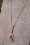 Shop Tarun Tahiliani Gold Plated Embellished Pear Pendant Drop Lariat Necklace at Aza Fashions Shop_Tarun Tahiliani_Gold Plated Embellished Pear Pendant Drop Lariat Necklace _at_Aza_Fashions
