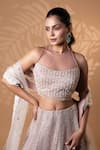 Shop_Jiya by Veer Design Studio_Pink Net Sequins, Beads, Embroidery Halter Neck, Keyhole Dusty Rose Lehenga Set _Online_at_Aza_Fashions