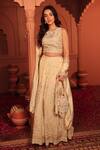 Shop_Tasuvure Indes_Ivory Georgette, Chiffon Sequins, Beads, Inaaya Cutdana Embroidered Lehenga Set _Online_at_Aza_Fashions