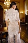 Seema Gujral_White Net Sequins, Stones, Tassels, Beads Open Embroidered Jacket Sharara Set _Online