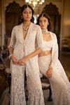 Seema Gujral_White Net Sequins, Beads, Stones, Embroidery Open Neck, Jacket Sharara Set _at_Aza_Fashions