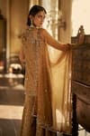 Seema Gujral_Gold Tissue, Silk Embroidery, Crystals, Stones Halter Neck Jewelled Sharara Set _Online_at_Aza_Fashions