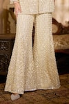 Seema Gujral_Cream Net Sequins, Pearls, Embroidery, Tassels Open Neck, Jacket Sharara Set _at_Aza_Fashions