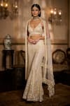 Shop_Seema Gujral_Cream Net Sequins, Pearls, Tassels, Fringe Sweetheart Embroidered Sharara Set _Online_at_Aza_Fashions