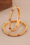 Shop_Smars Jewelry_Gold Plated Stones Antique Carved Ruby Studded Pair Of Bangles _at_Aza_Fashions