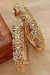 Shop_Saga Jewels_Gold Plated Carved Temple Bangles - Set Of 2 _at_Aza_Fashions