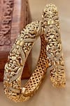 Buy_Saga Jewels_Gold Plated Carved Temple Bangles - Set Of 2 _at_Aza_Fashions