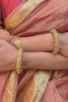 Buy_Saga Jewels_Gold Plated Stones, Carved Temple Bangles - Set Of 2 _at_Aza_Fashions