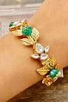 Buy_Saga Jewels_Gold Plated Stones Leaf Motif Embellished Bangle _at_Aza_Fashions