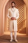 Buy Millionaire Cream Silk Zari, Pearls, Embroidery Floral Pattern Sherwani Set at Aza Fashions Buy_Millionaire_Cream Silk Zari, Pearls, Embroidery Floral Pattern Sherwani Set _at_Aza_Fashions