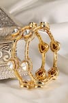 Shop Prestones Gold Plated Stones Polki Textured Bangles at Aza Fashions Shop_Prestones_Gold Plated Stones Polki Textured Bangles _at_Aza_Fashions