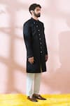 Shop Arihant Rai Sinha Black Satin, Polyester, Viscose Embroidery, Studs Textured Sherwani And Pant Set Shop_Arihant Rai Sinha_Black Satin, Polyester, Viscose Embroidery, Studs Textured Sherwani And Pant Set