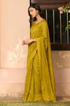 Shop_Vaayu_Yellow Muslin, Cotton Embroidery V-neck, Round Tuscany Floral Saree With Blouse _Online_at_Aza_Fashions