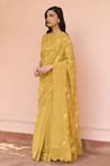 Shop_Vaayu_Yellow Muslin, Cotton Embroidery Round Neck Rue Thread Saree With Blouse _Online_at_Aza_Fashions