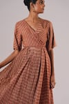 Buy_Urvashi Kaur_Brown Kota Doria V-neck Continuum Zari Striped Pleated Dress _Online_at_Aza_Fashions