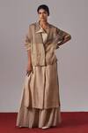 Urvashi Kaur_Gold Tissue, Silk V-neck Sabi Panelled Handwoven Jacket _Online_at_Aza_Fashions