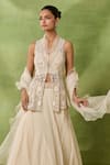 Awigna_Ivory Organza, Net Embroidery, Sequins, Beads High Ebonee Peplum Top Skirt Set _Online_at_Aza_Fashions