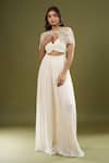 Buy Couture By Niharika Ivory Sweetheart , Round Pleated Jumpsuit With Cape at Aza Fashions Buy_Couture By Niharika_Ivory Sweetheart , Round Pleated Jumpsuit With Cape _at_Aza_Fashions