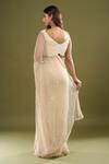 Shop_COUTURE BY NIHARIKA_Beige Pearls, Sequins V-neck Embroidered Saree With Blouse _at_Aza_Fashions
