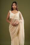 Buy_COUTURE BY NIHARIKA_Beige Pearls, Sequins V-neck Embroidered Saree With Blouse _Online_at_Aza_Fashions