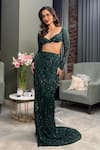 Diyarajvvir_Green Tulle Sequins Sweetheart Neck Embellished Blouse With Slit Skirt _at_Aza_Fashions