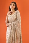 Buy_Nakul Sen_Beige Sequins, Tassels Embroidered Saree With Unstitched Blouse Piece _Online_at_Aza_Fashions