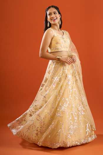 Samyukta Singhania_Yellow Net Sequins V-neck Floral Embroidered Lehenga Set _at_Aza_Fashions