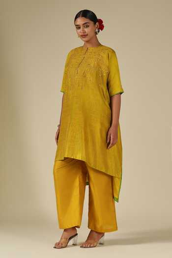 LATHA PUTTANNA_Mustard Silk, Cotton Embroidery, Mirrors Round Neck Raw Kurta And Pant Set _at_Aza_Fashions