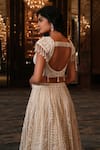 Shop_Nikunj By NIIDHI BAJAJ_Cream Net Embroidery, Pearls, Tassels Sweetheart Neck Noorani Lehenga Set _at_Aza_Fashions