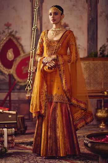 Shop_Reeti Arneja_Yellow Silk Zari, Tassels Scoop Neck, Yes Zardozi Kesari Kurta And Sharara Set _at_Aza_Fashions