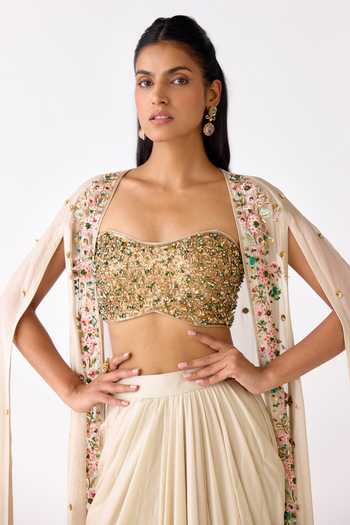 Basanti Kapde aur Koffee_Ivory Organza, Viscose, Lycra Sequins, Embroidered Border Cape And Skirt Set _at_Aza_Fashions