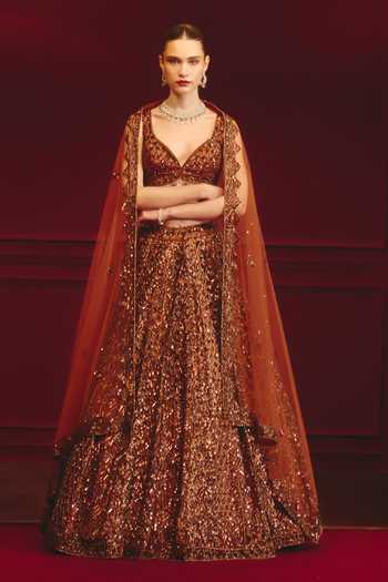 Buy_ANGAD SINGH_Brown Net Sequins, Tassels Sweetheart Neck Carob Majesty Embroidered Lehenga Set _at_Aza_Fashions