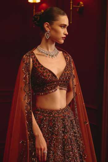 ANGAD SINGH_Brown Net Sequins, Tassels Sweetheart Neck Carob Majesty Embroidered Lehenga Set _at_Aza_Fashions