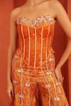 Shop_Label Astha Chhabra_Orange Organza Stones, Mirrors Bandeau Neck Embroidered Corset And Sharara Set _Online_at_Aza_Fashions