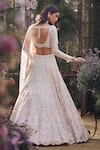 Seema Gujral_Peach Net Sequins, Beads, Pearls, Zari Regal Motif Embroidered Lehenga Set _Online_at_Aza_Fashions