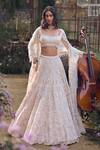 Buy_Seema Gujral_Peach Net Sequins, Beads, Pearls, Zari Regal Motif Embroidered Lehenga Set _at_Aza_Fashions