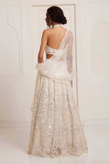 Shop_Surily G_Ivory Net Embroidery, Sequins, Mirrors Halter Neck Lehenga Set _at_Aza_Fashions