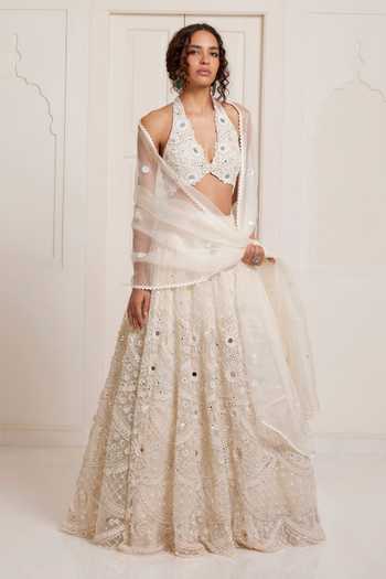 Buy_Surily G_Ivory Net Embroidery, Sequins, Mirrors Halter Neck Lehenga Set _at_Aza_Fashions