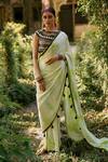 Buy_Surily G_Green Crepe, Net Tassels, Embroidery Boat Neck Border Pre-draped Saree And Top Set _at_Aza_Fashions