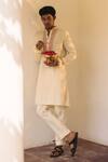 Buy_Nafs_Peach Cotton, Lurex Embroidery Rose Hand Kurta And Pant Set _at_Aza_Fashions