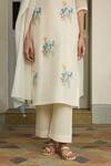 Shop_Vaayu_Blue Muslin Applique, Tassels Round Neck Ivory Floral Kurta Set _Online_at_Aza_Fashions